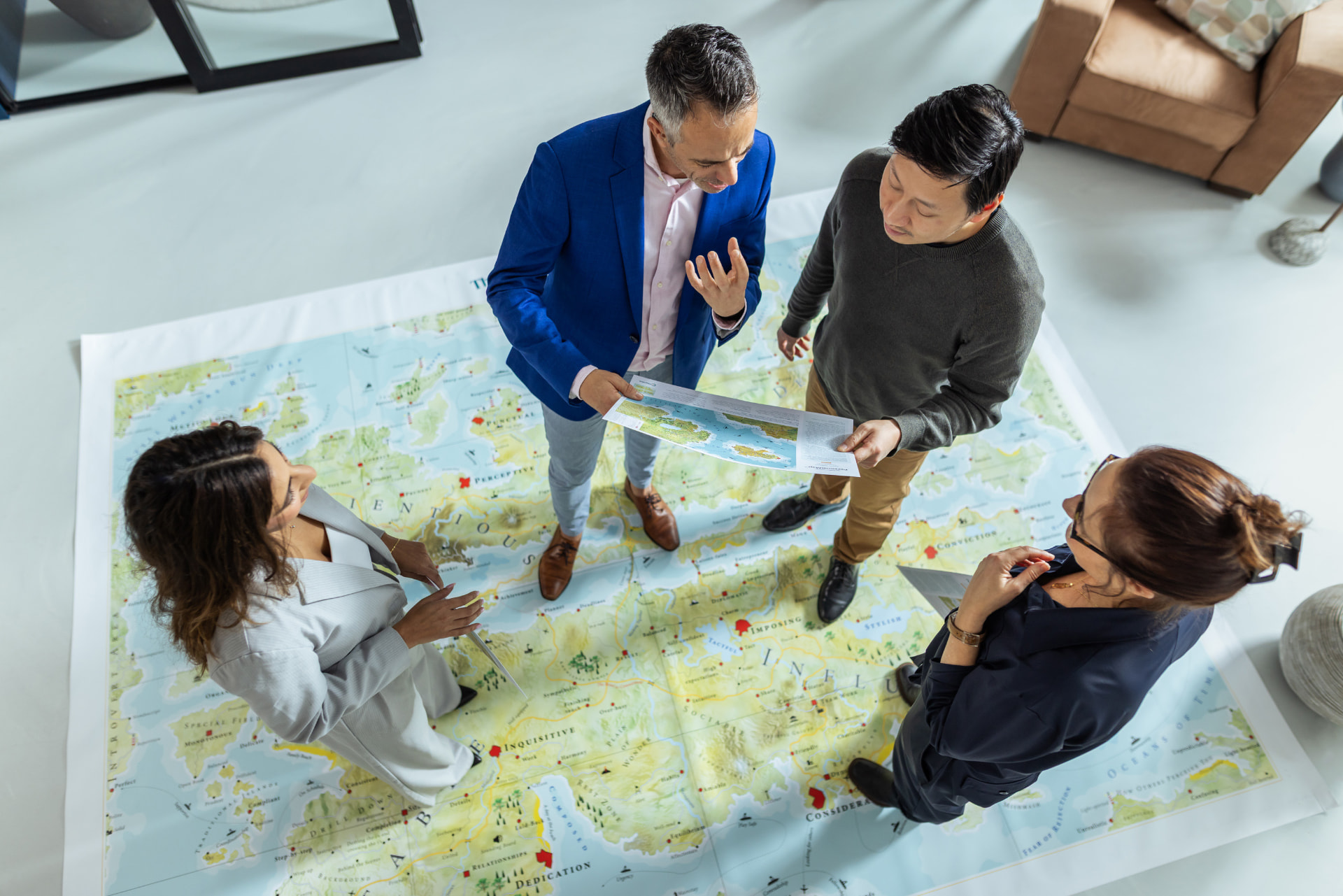 Participants walking on a giant Mapstell map to explore their communication styles.